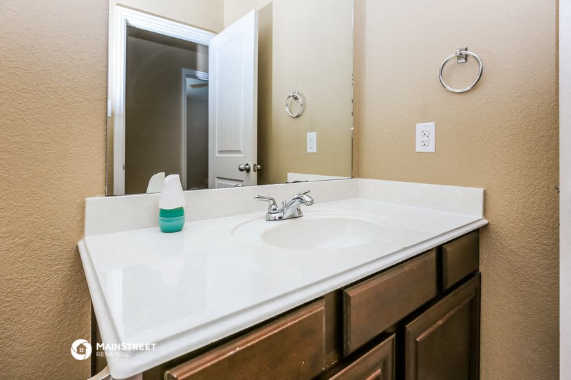 a bathroom with a sink and a mirror