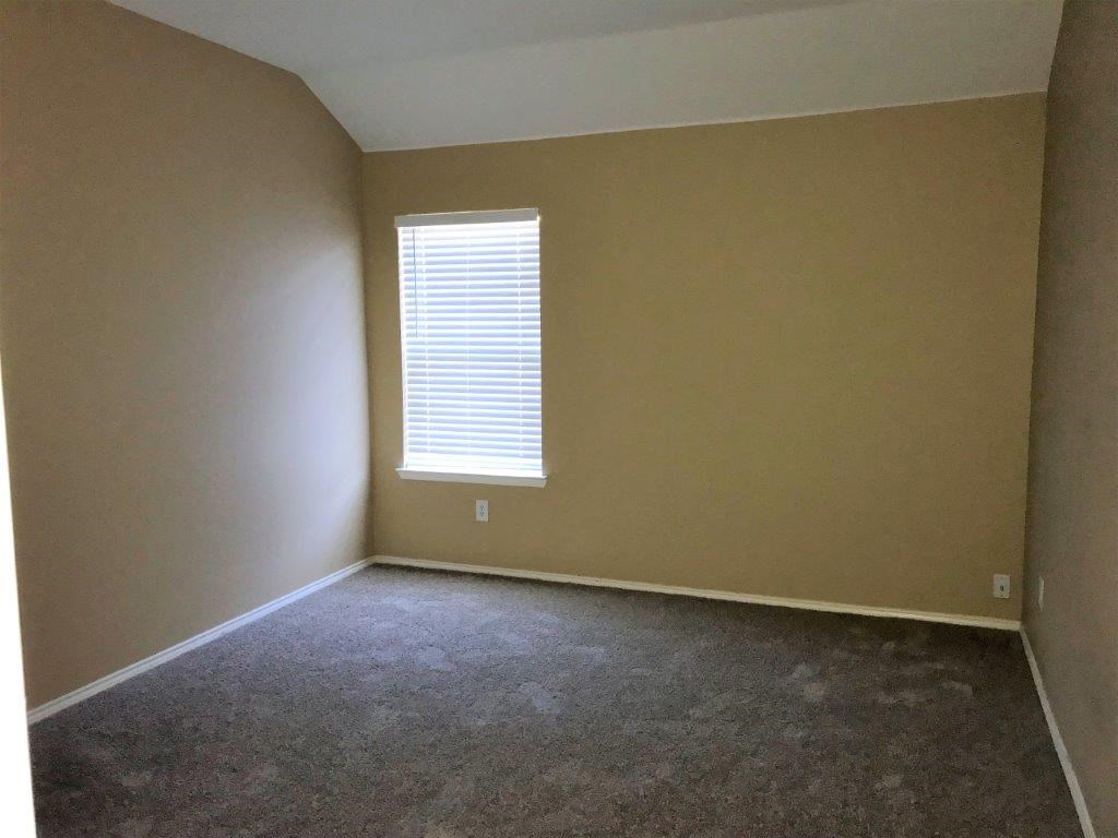 an empty room with a window in it