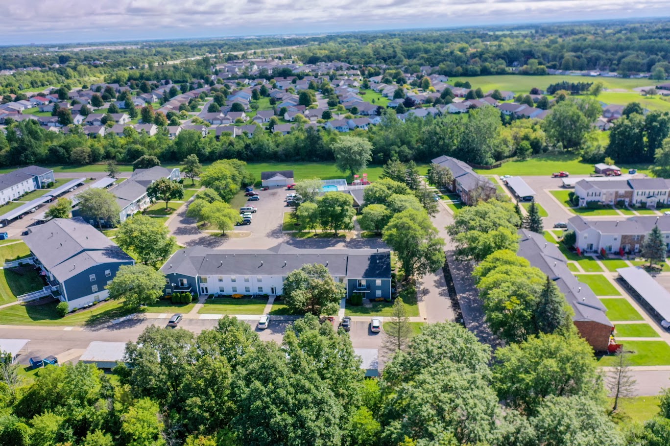 an aerial view of a neighborhood with houses and trees