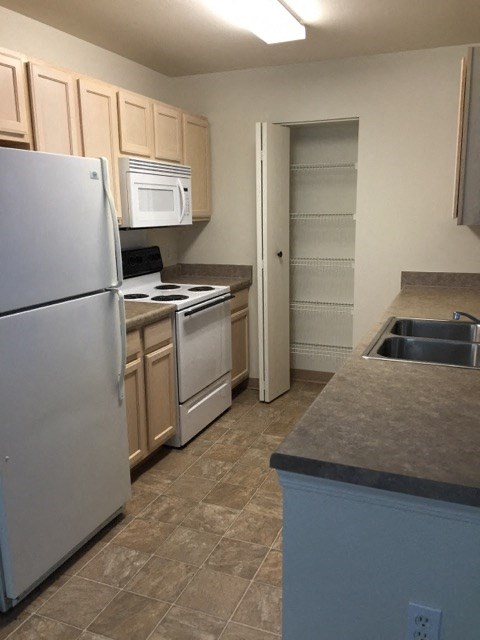 a kitchen with stainless steel appliances and a sink
