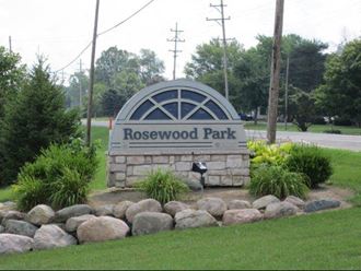 a park with a sign that says rosewood park