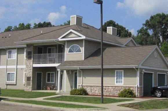 a house with a car parked in front of it