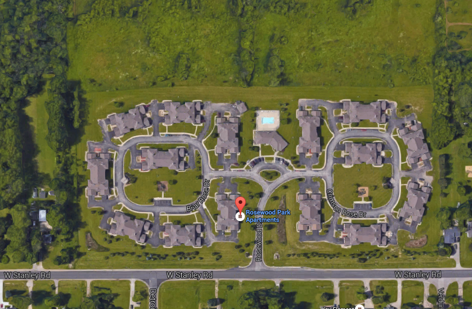 a screenshot of a neighbourhood with a red stop light