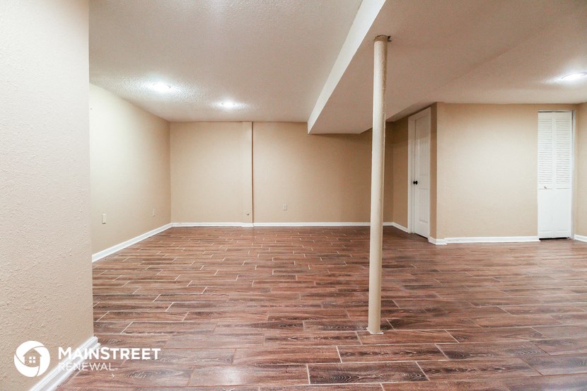 a empty room with a pole in the middle of it