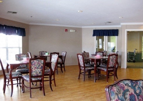 a dining room with a table and chairs in it