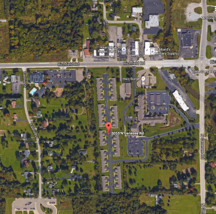 a map of the area with a red marker on it