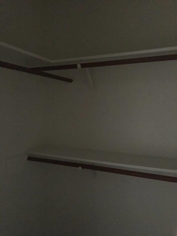 a white ceiling with a shelf on it