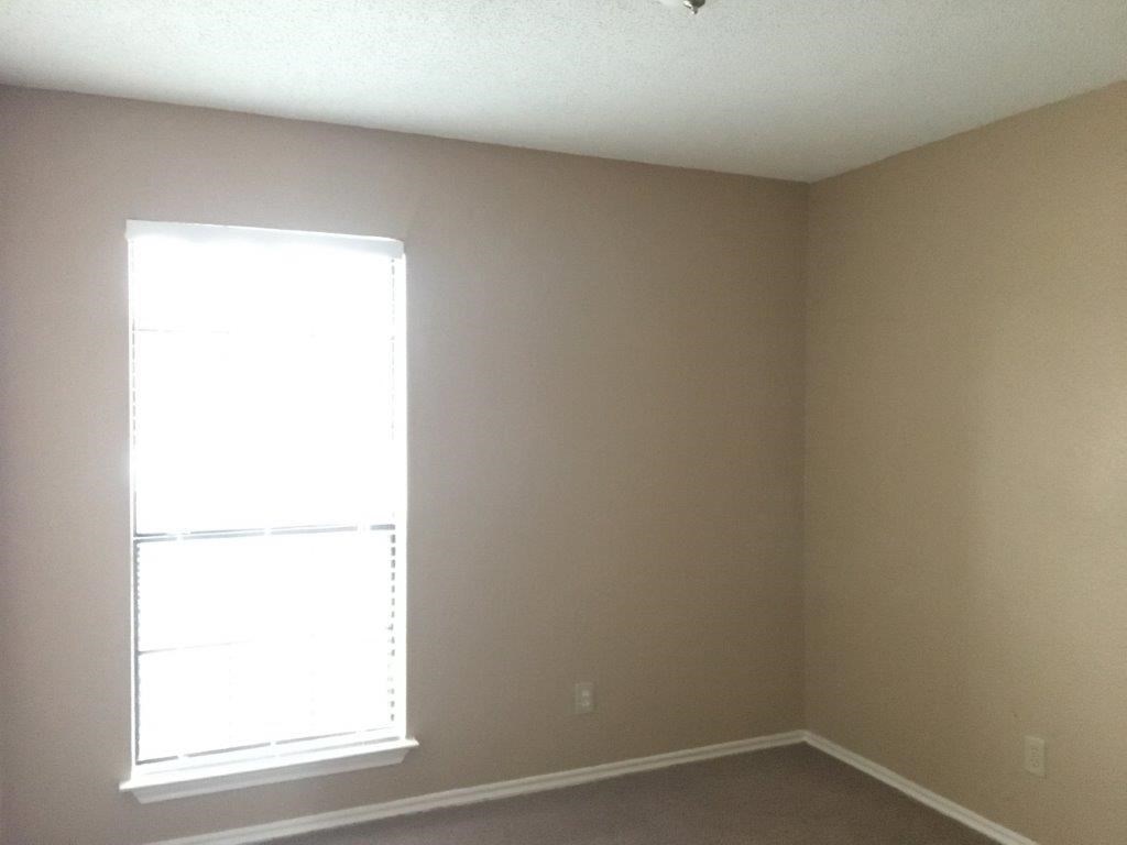 an empty room with a window in it