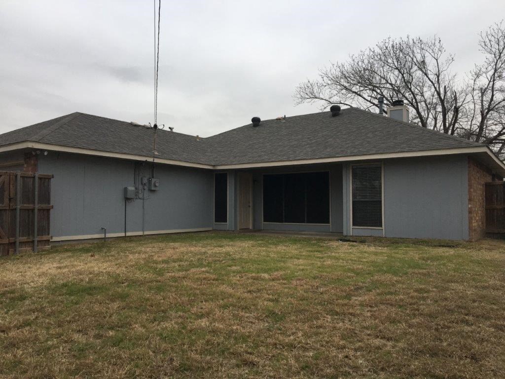a view of the front of a house with a yard