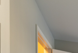 an empty room with a white door and a window
