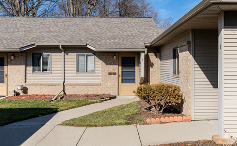 a house with a sidewalk in front of it
