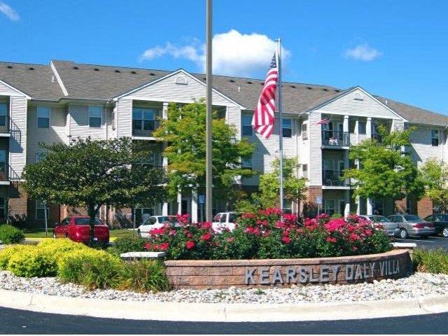 an flag in front of an apartment building