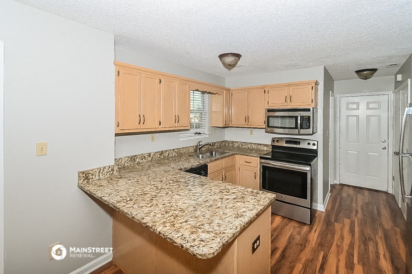 a kitchen with a granite counter top and