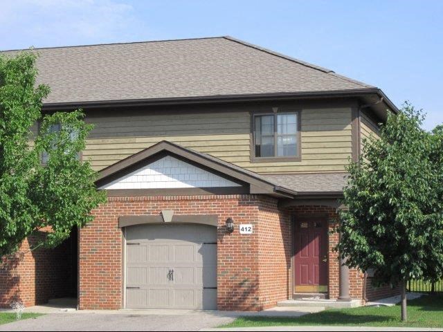 a brick house with a garage door
