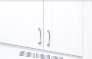 a white kitchen with white appliances and white cabinets