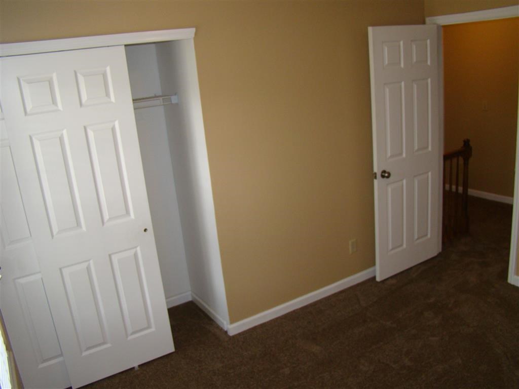a room with two doors and a closet