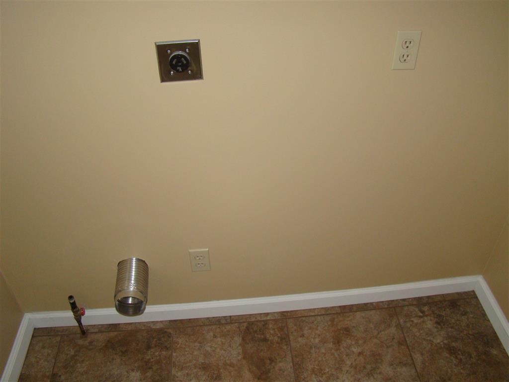 a empty room with a trash can on the floor