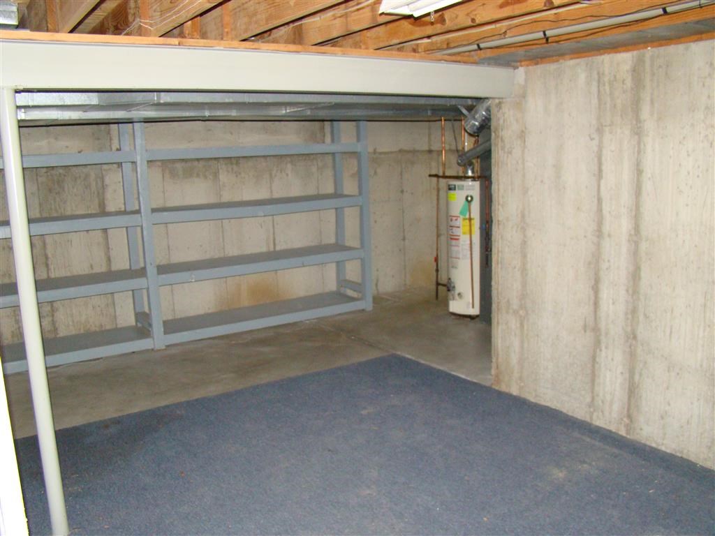 the inside of a garage with a steel door