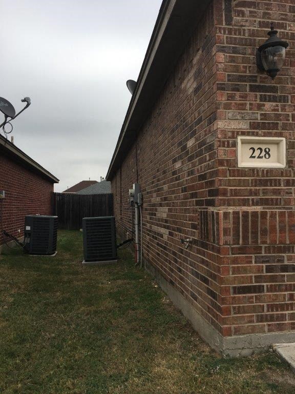 a brick building with a sign on the side of it