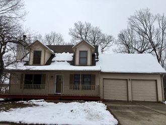a house with snow on the roof