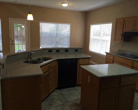 a kitchen with a sink and a counter top