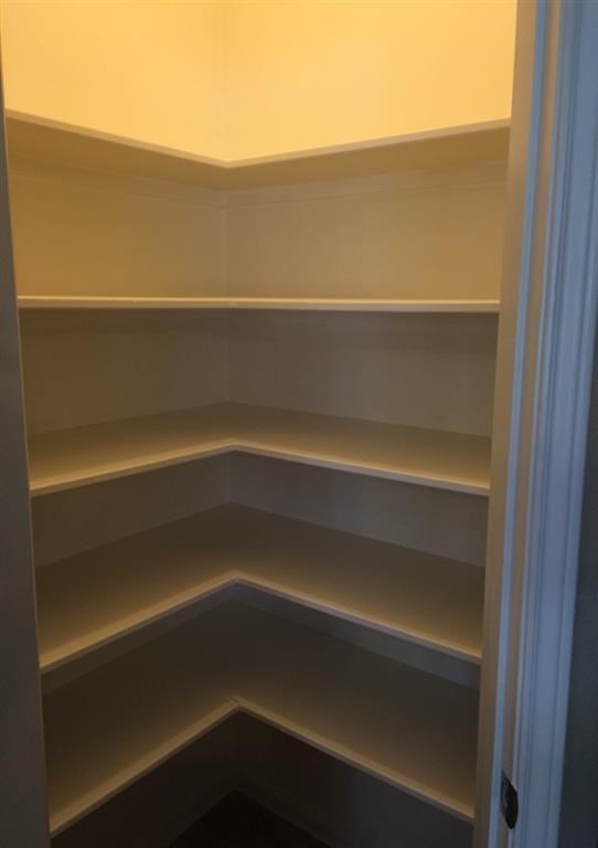 a empty shelf in a closet
