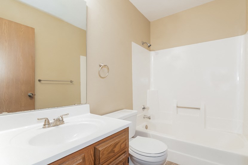 the preserve at ballantyne commons apartment bathroom with sink toilet and shower