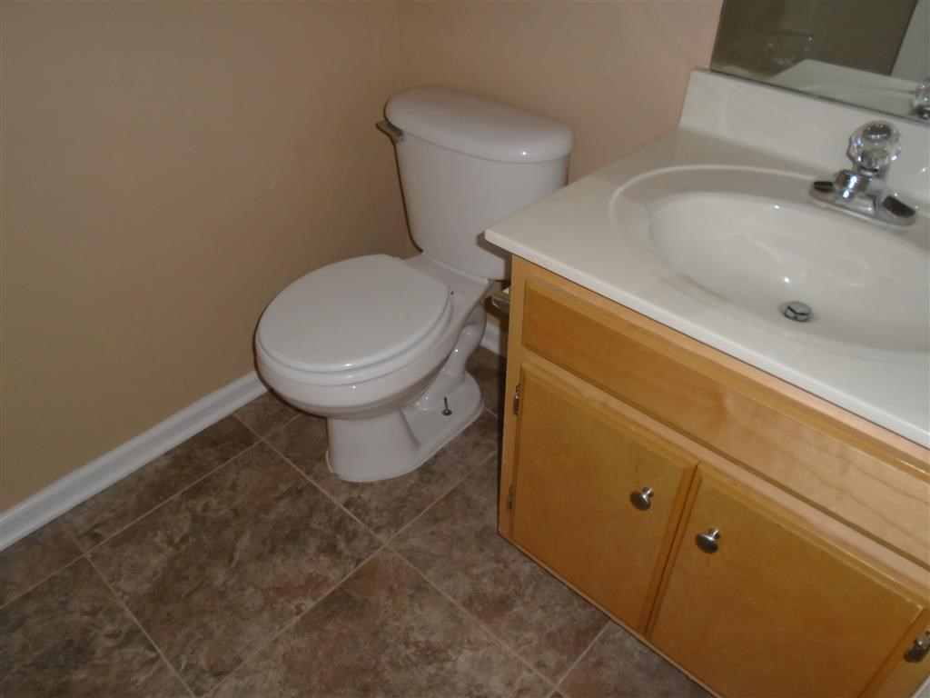 a bathroom with a toilet and a sink