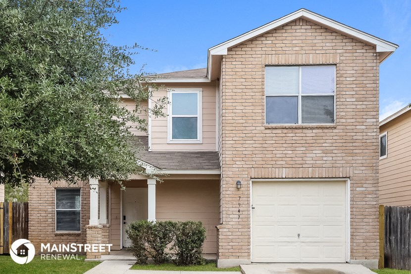 a brick house with a white garage door