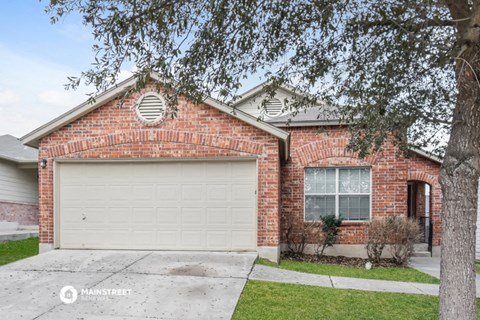 a brick house with a white garage door