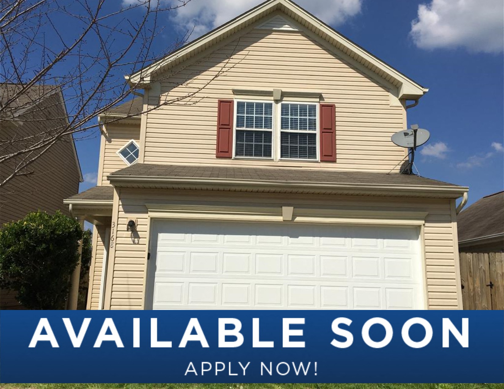a tan house with a white garage door and a sign that reads available soon