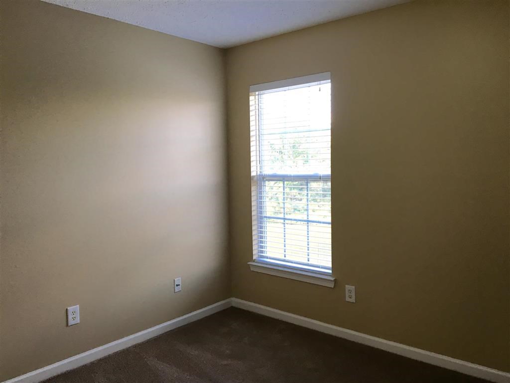 an empty room with a window in it