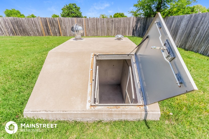 an old ice box in a backyard with the door open