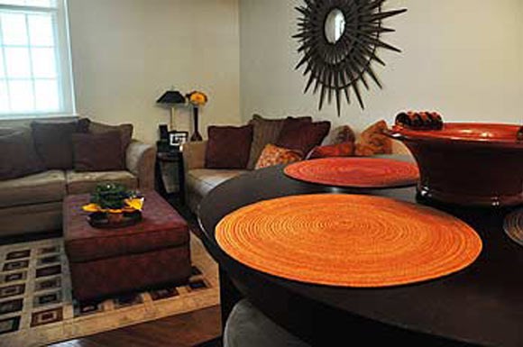 a living room with a table and a couch