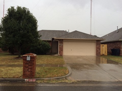 a house with a driveway and a garage door