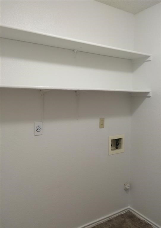 a white room with a shelf on the wall