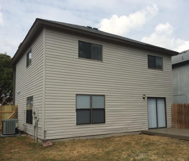 a white house with a garage and a yard