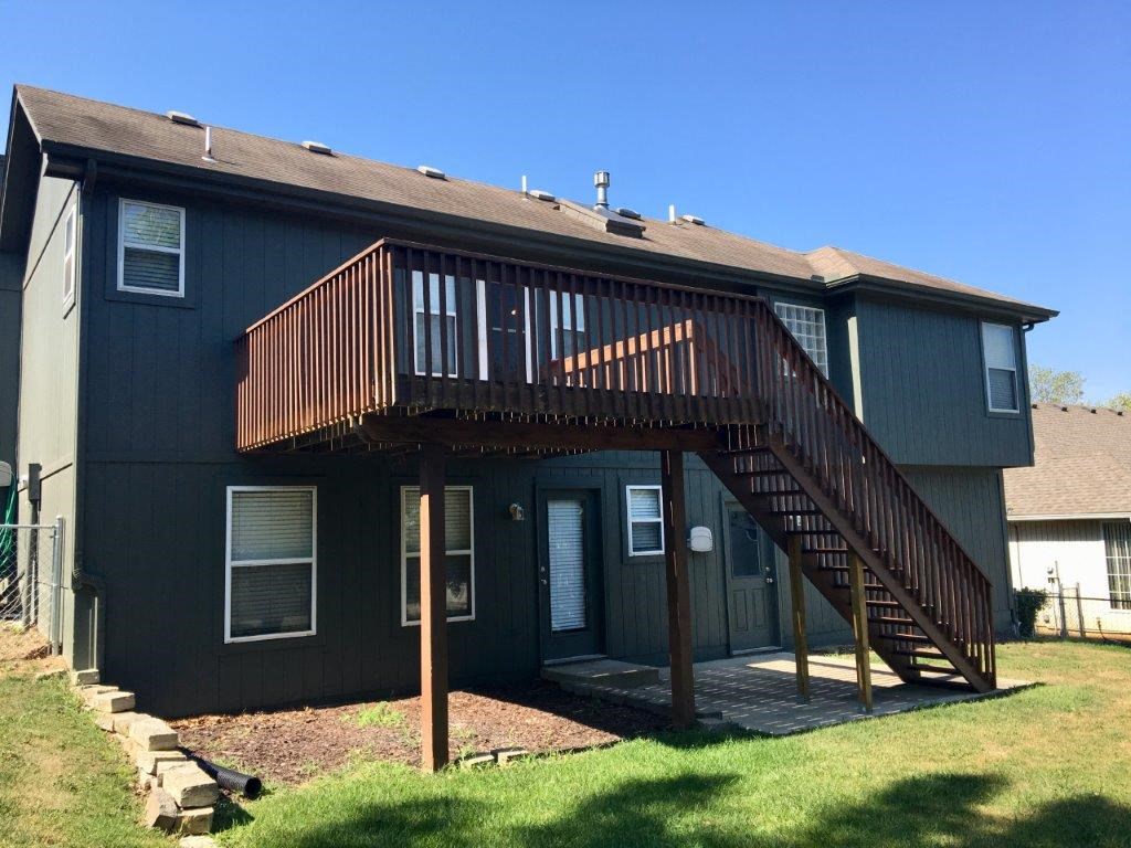 a house with a deck on top of it