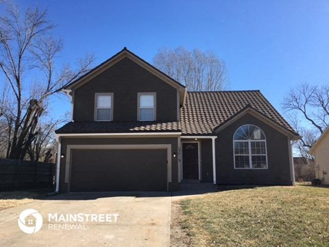 a house with a driveway and a garage door
