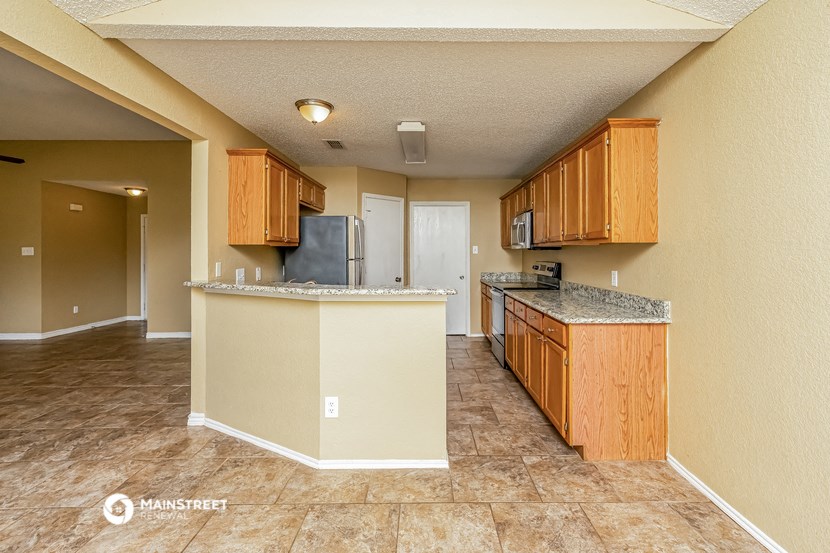 a kitchen with a counter top and a sink