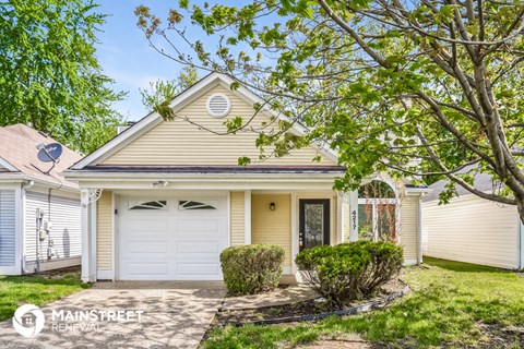 a white house with a white garage door