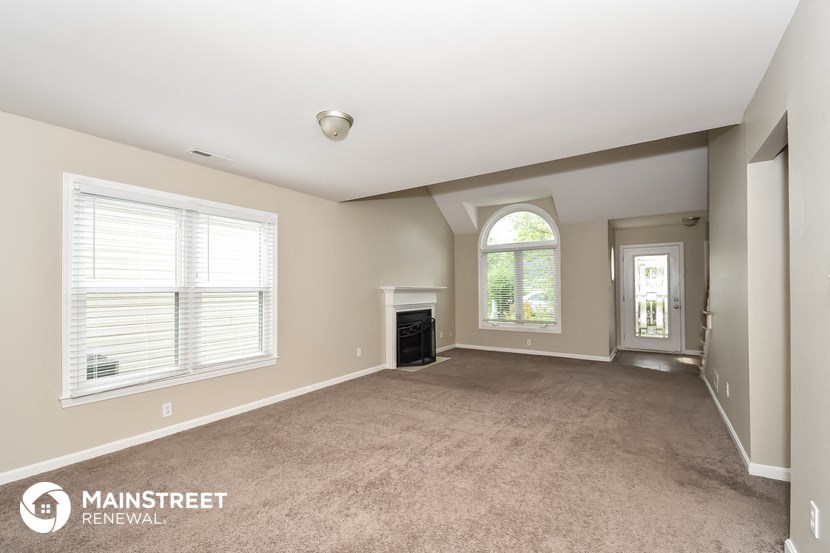 the living room and dining room are spacious and empty