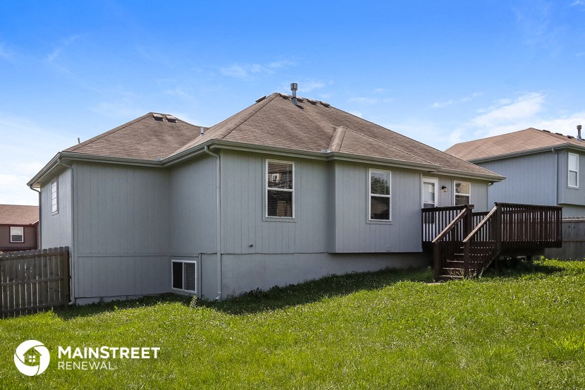 a with a yard and a deck