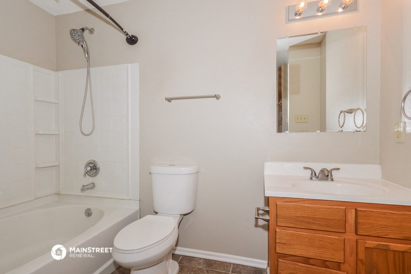 a bathroom with a sink toilet and shower and a bath tub