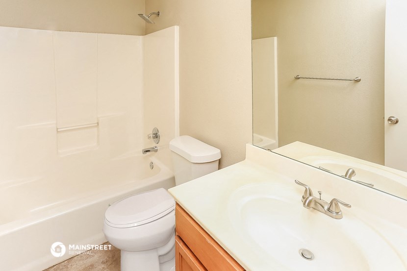 a bathroom with a sink toilet and a tub