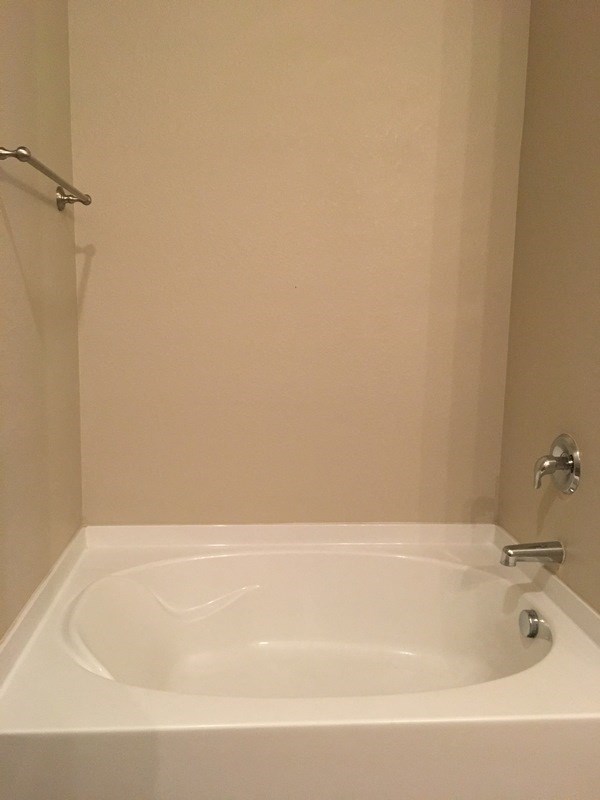 a small bathroom with a sink and a shower