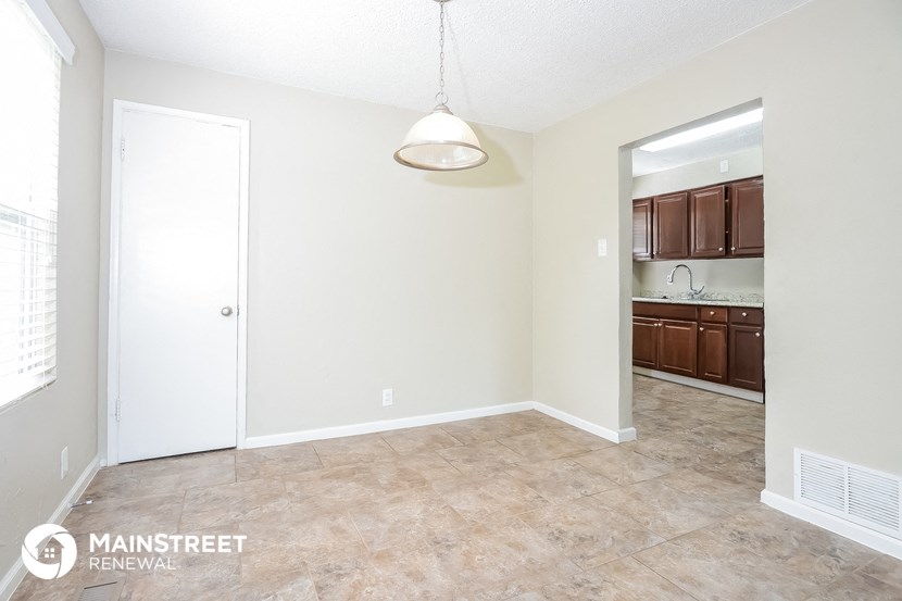 the spacious living room and kitchen of this manufactured home