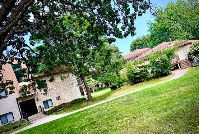 a brick building with a tree in front of it