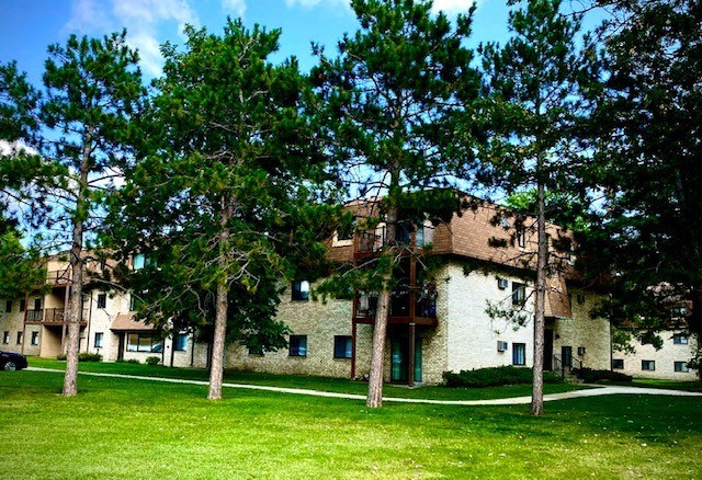 a large building with trees in front of it