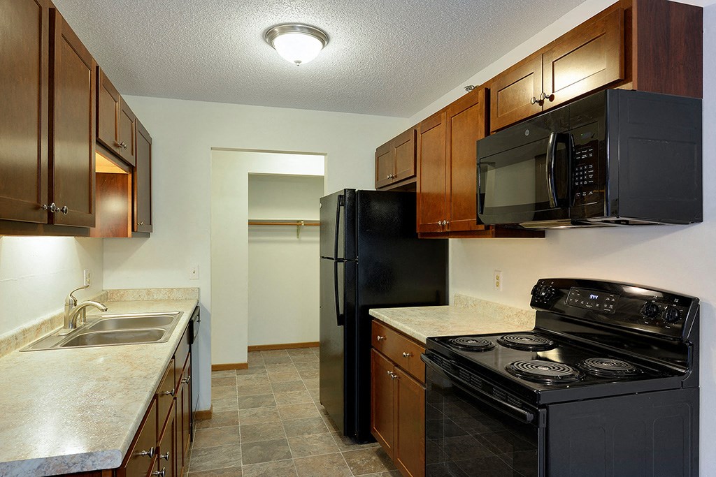 Pine Point is a similar property to Woodland North Apartments located in Coon Rapids